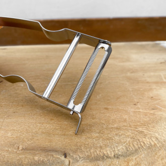 Castor stainless steel peeler