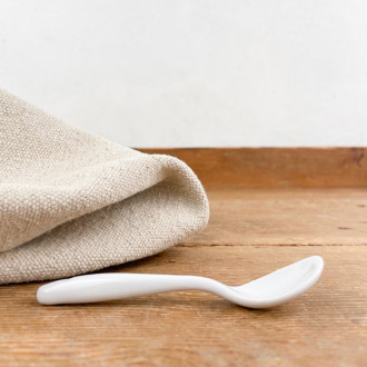 Small white porcelain spoon