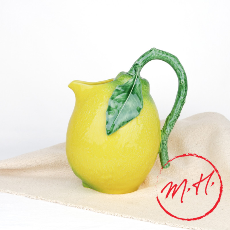 Lemon-shaped glazed earthenware decanter, front view