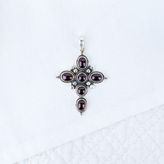 silver cross with garnet stones