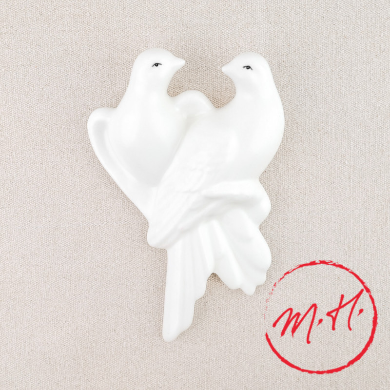 Wall-mounted white doves