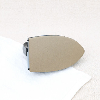 Mini iron with non-adhesive soleplate