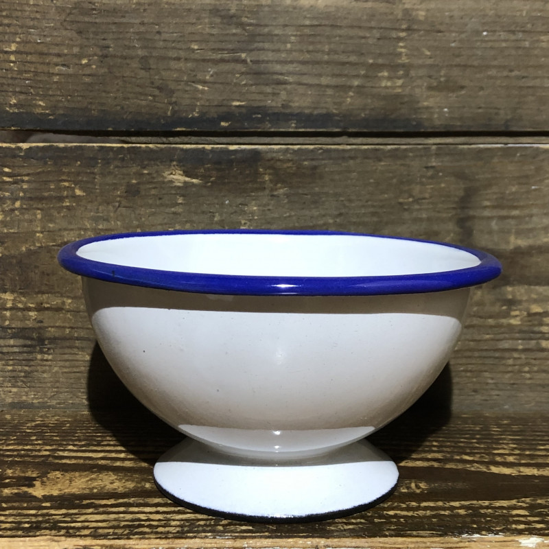 White enamel footed bowl with blue border