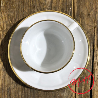 White cup and saucer with gold thread