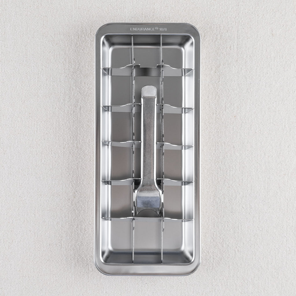 Stainless steel ice cube tray with ejector