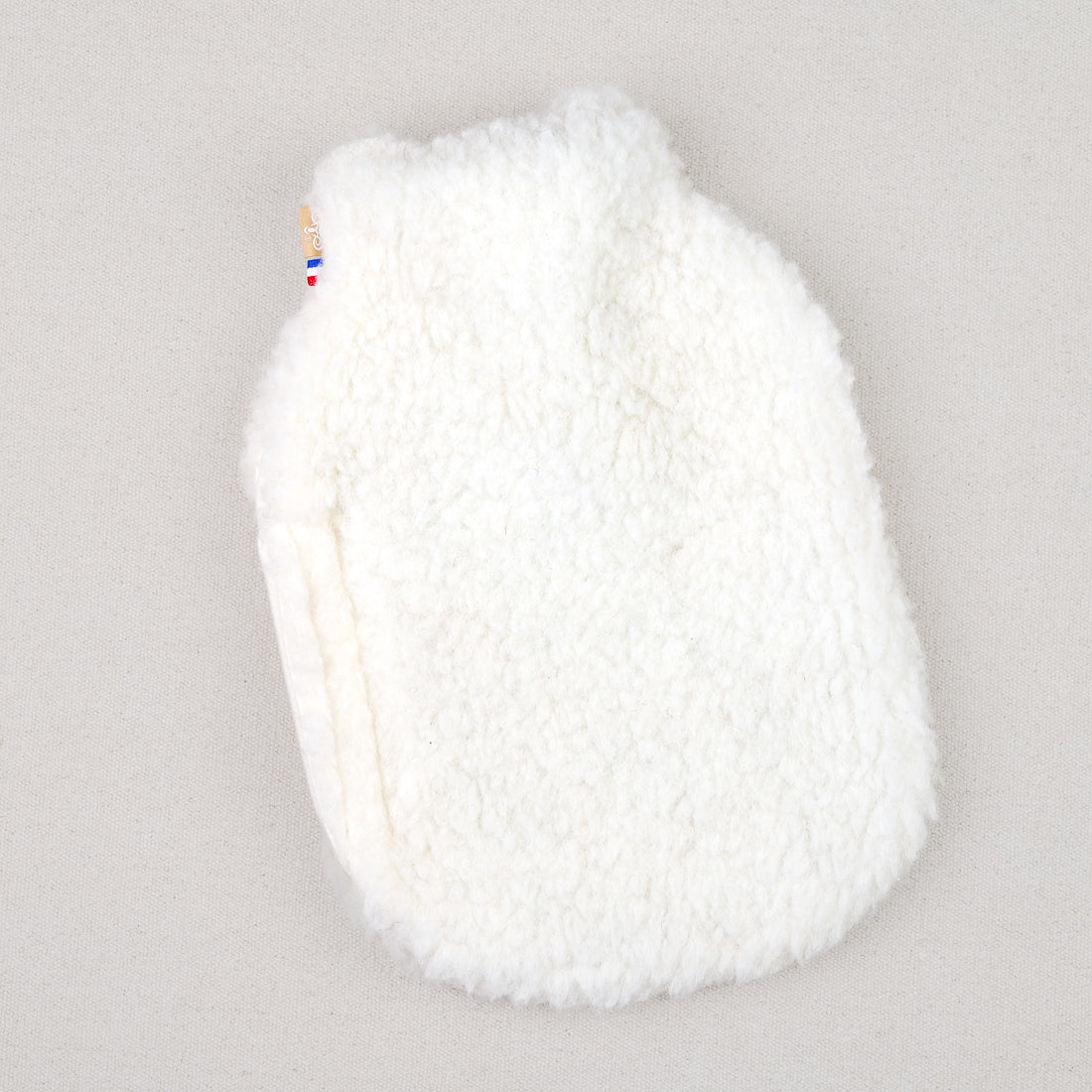 Bouillotte et housse en laine de mouton