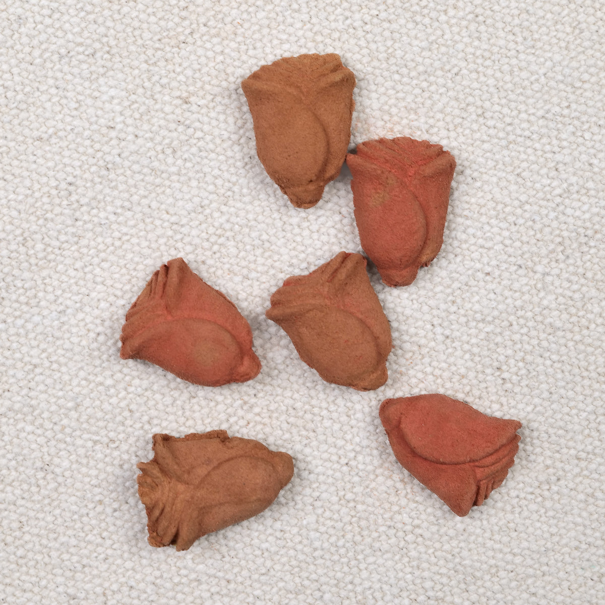 Cade wood incense figurines