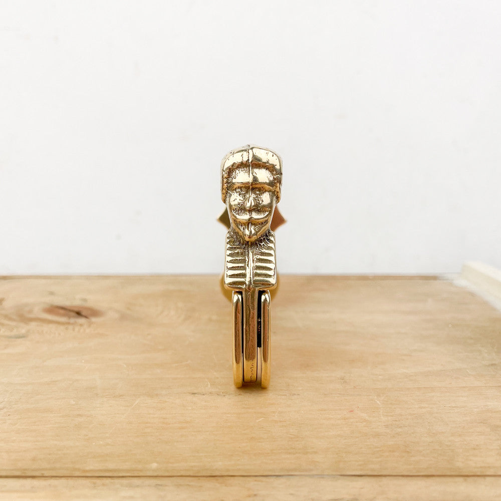 Brass shutter stop with man / shepherdess head