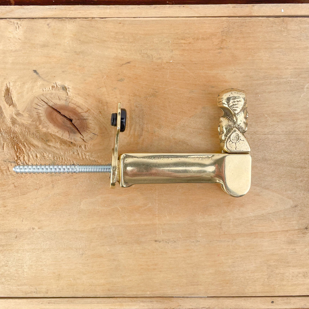 18th-century brass shutter stop