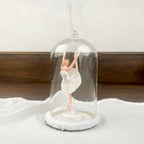 Hanging ballerina under dome