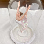 Hanging ballerina under dome