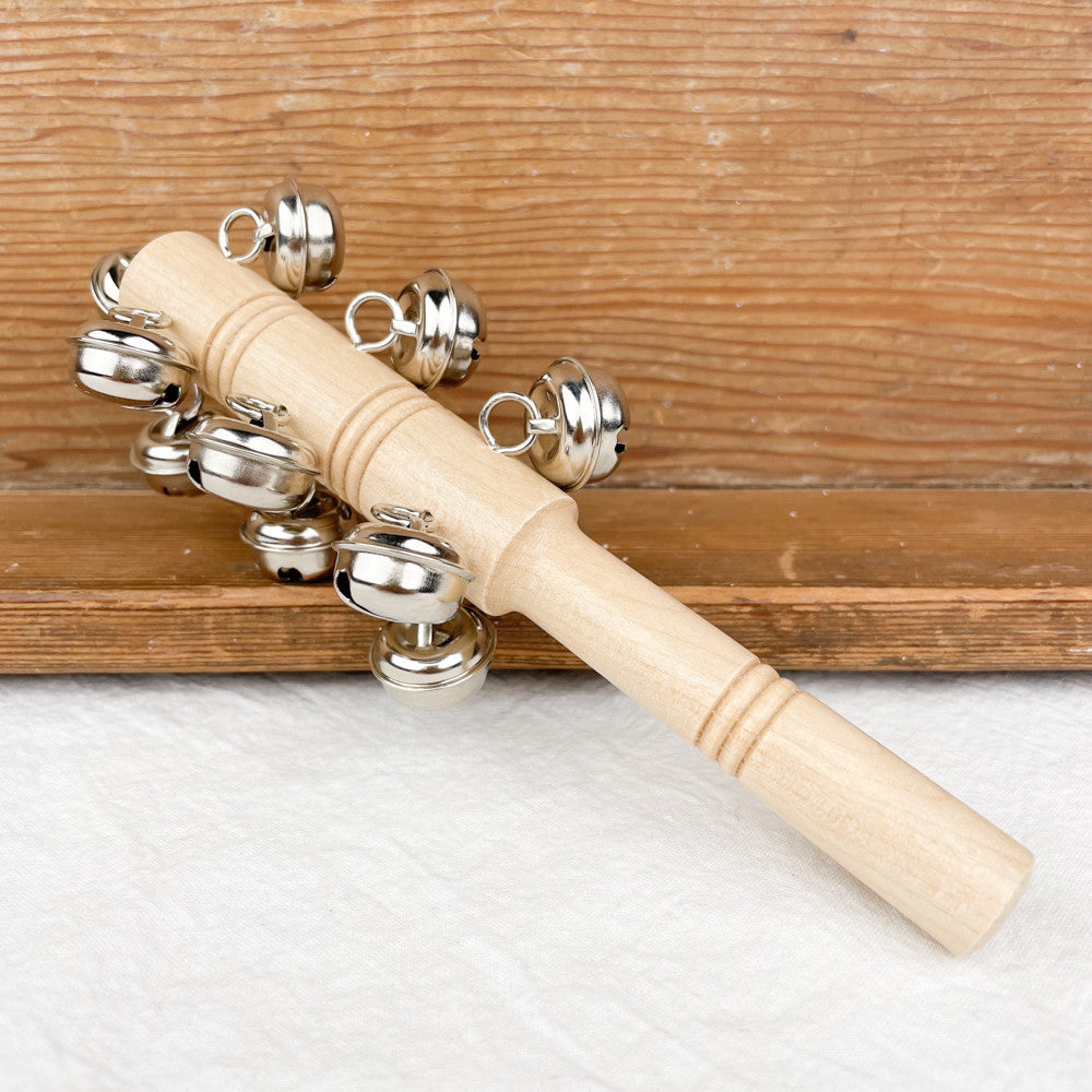 Baton with bells in wood and metal