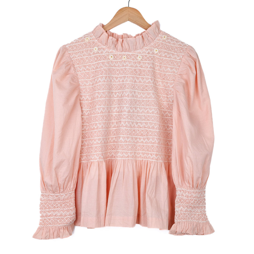 Pink smocked blouse
