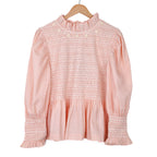 Pink smocked blouse