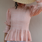 Pink smocked blouse
