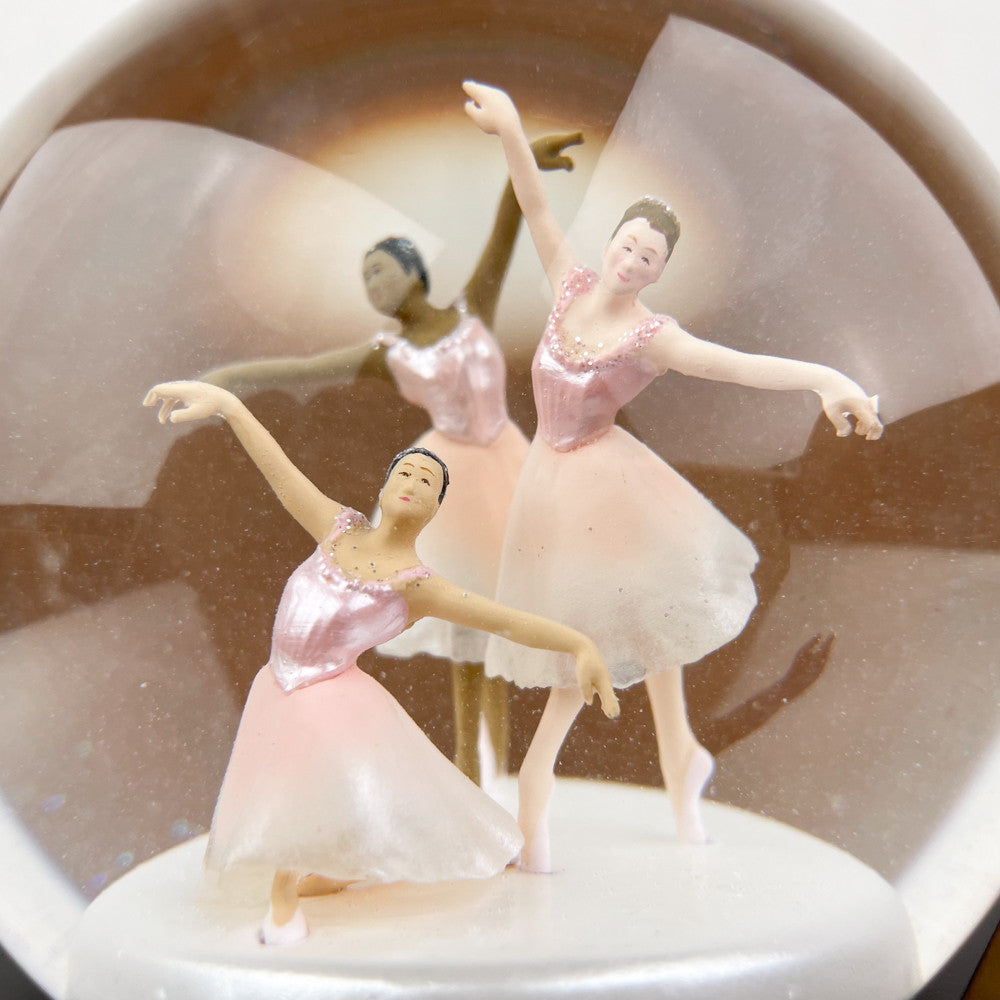 Ballerinas in a snow globe