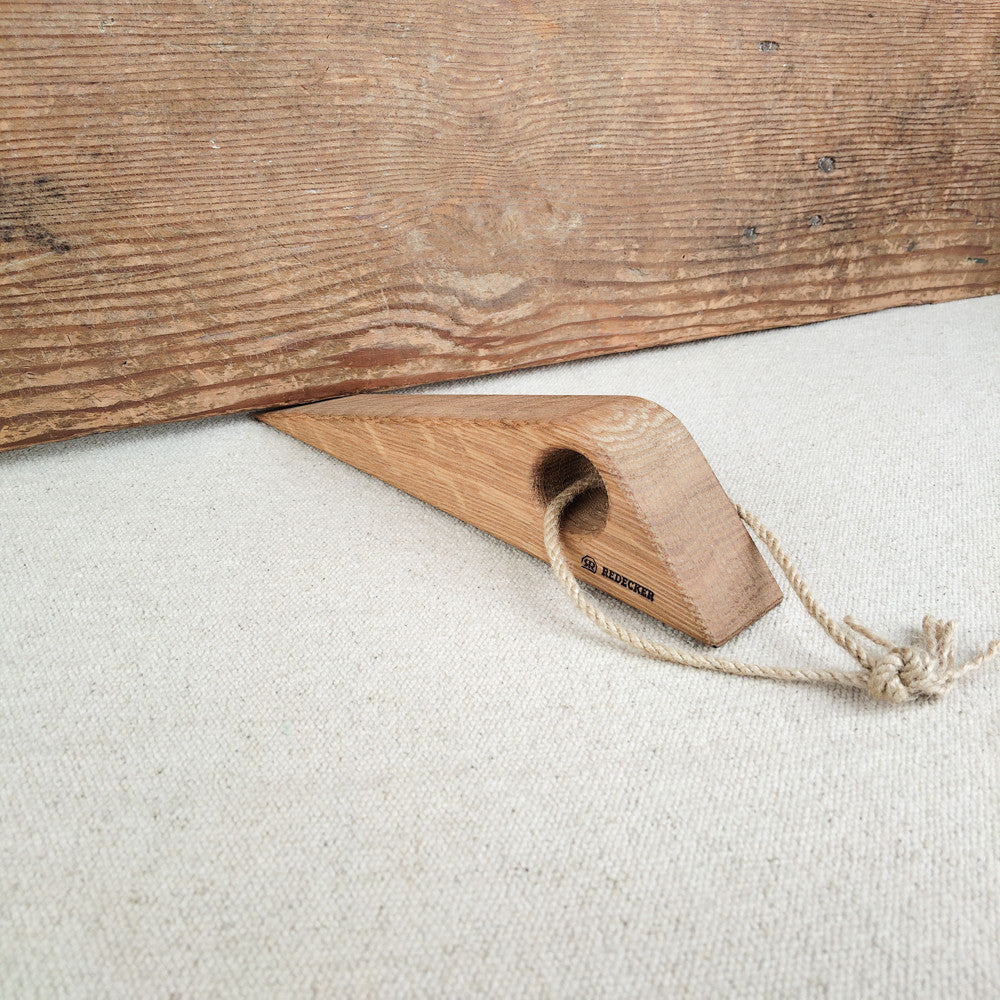 Wooden door wedge with rope