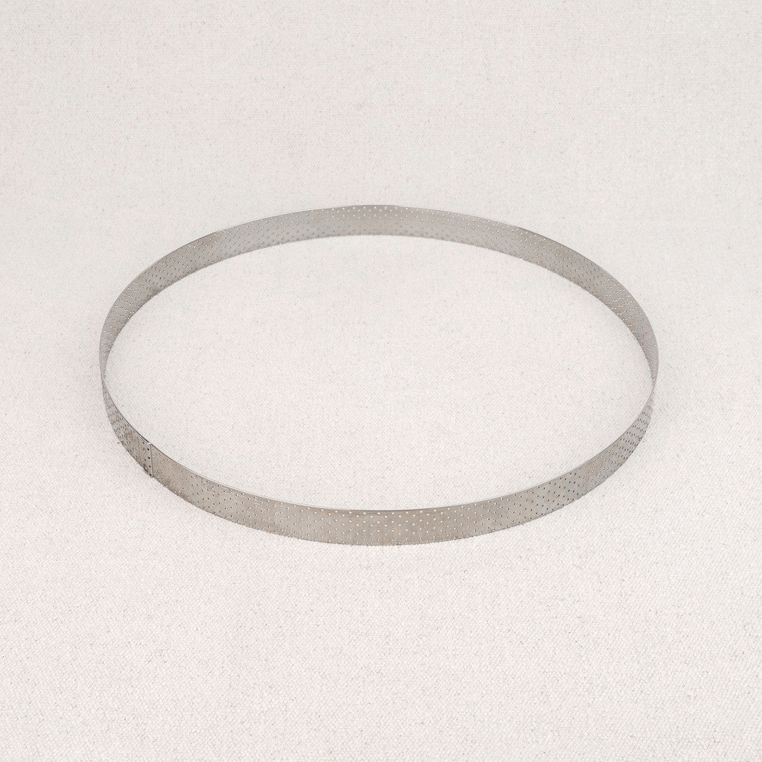 Cercle à tarte perforé en inox De Buyer 28,5 cm
