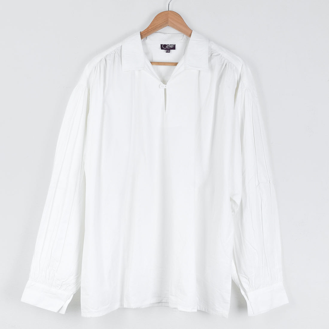 White Picasso shirt by Coline Diffusion, open V-neck, long sleeves, relaxed fit, one size