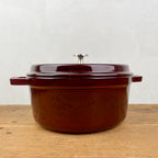 Round cast-iron casserole, garnet-red