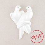 Wall-mounted white doves