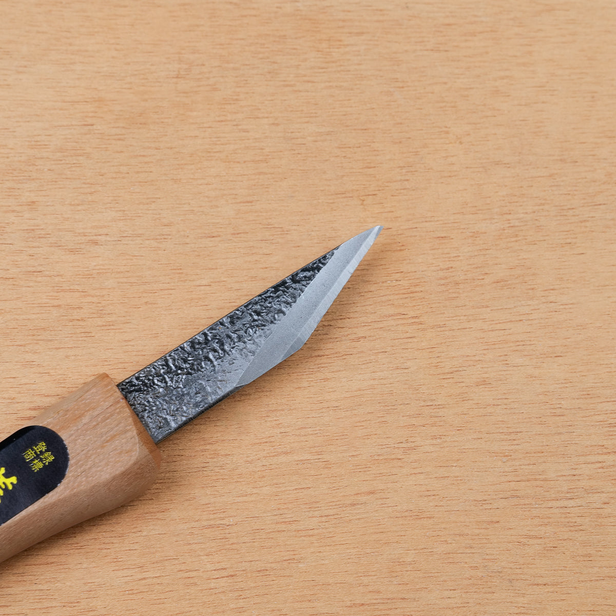 Japanese carving knife with Blue Paper steel blade, hand-forged tip and sharp edge detail