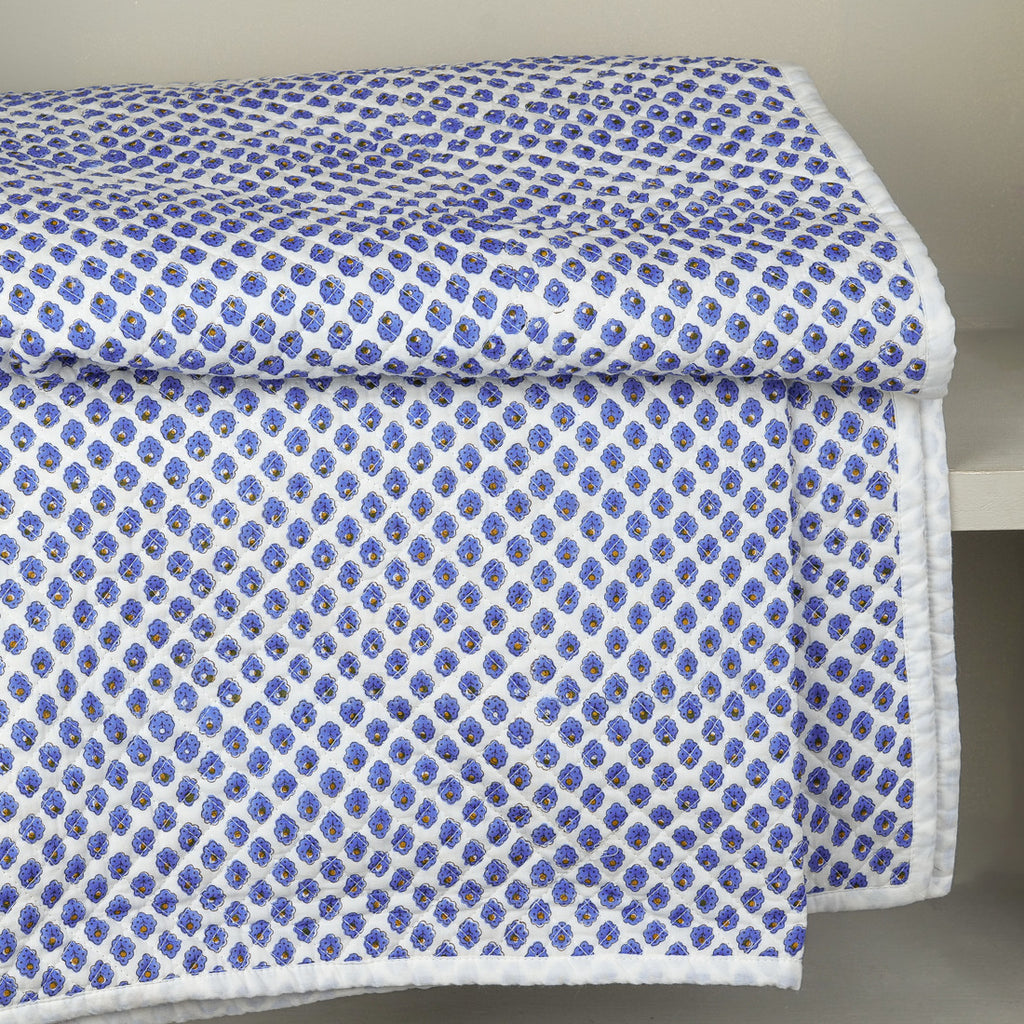 Blue daisy quilted bedspread
