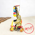 Elephant on mechanical tricycle