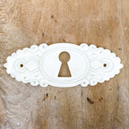 Entrée de clef en os et porcelaine