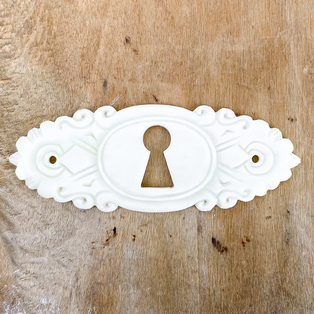 Entrée de clef en os et porcelaine