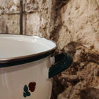 Enamelled casserole with floral design