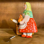 Wind-up mechanical farmer's wife with goose toy