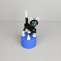 Jouet mécanique en bois noir articulé sur socle bleu, figurine Mechato wakouwa dès 3 ans, petite ménagerie