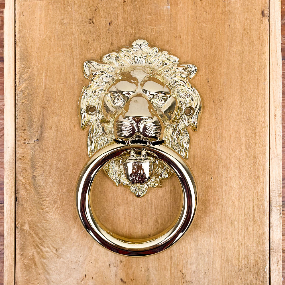 Heurtoir de porte tête de lion en laiton poli