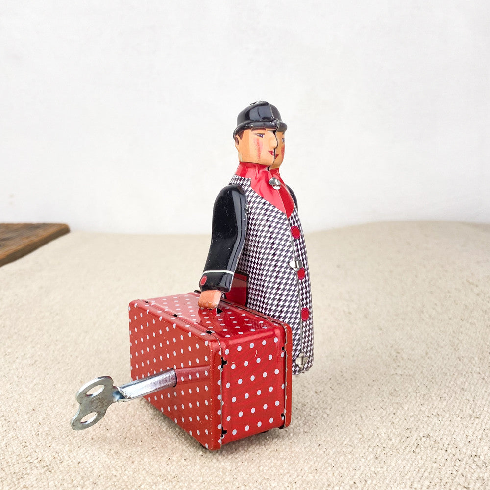 Man with red suitcase