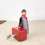 Man with red suitcase