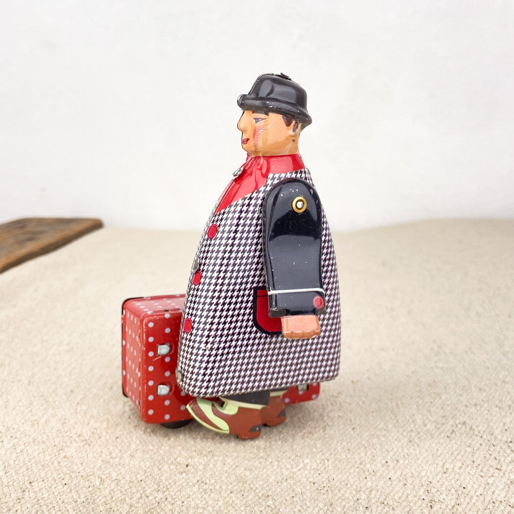 Man with red suitcase
