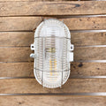 Lampe hublot en bakélite pour salle de bain