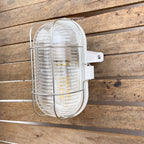 Lampe hublot en bakélite pour salle de bain