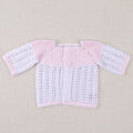 White and pink cotton layette