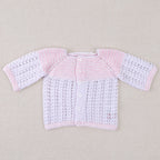 White and pink cotton layette