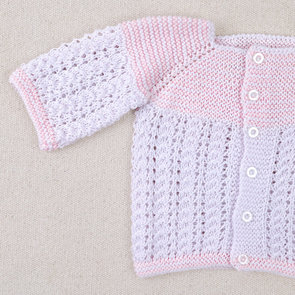 White and pink cotton layette