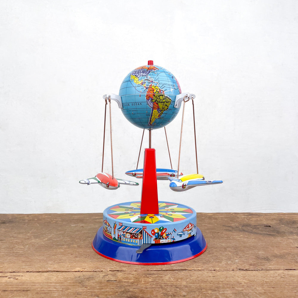 Wind-up aeroplane carousel in painted tin