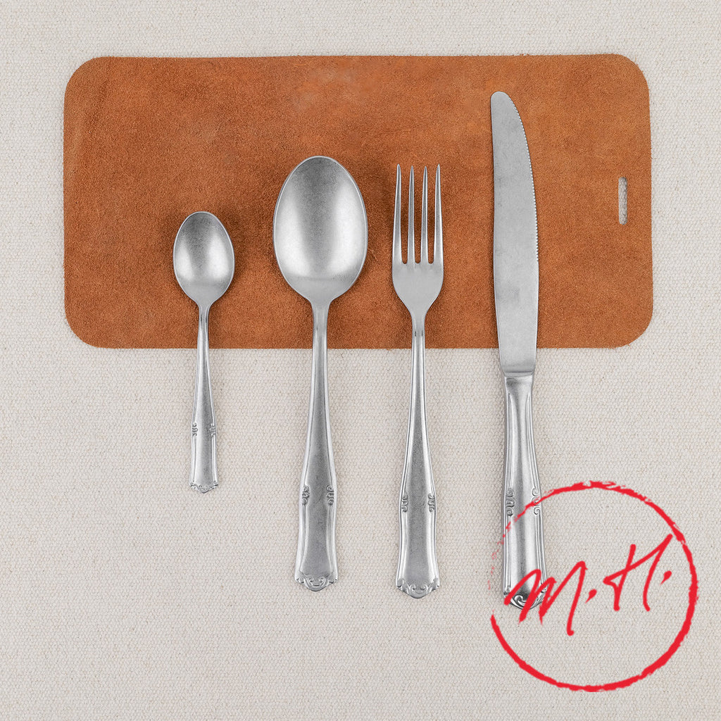 Ornate pewter 24-piece cutlery set