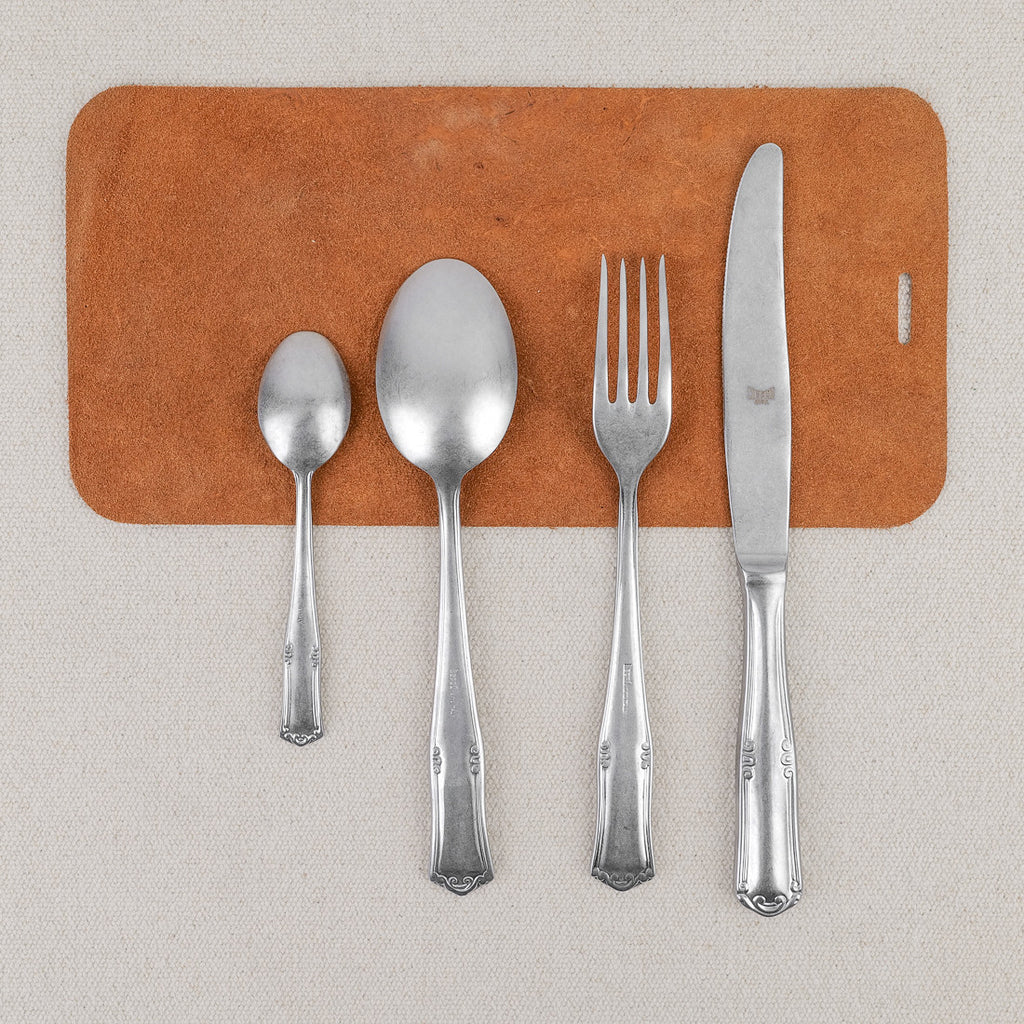 Ornate pewter 24-piece cutlery set