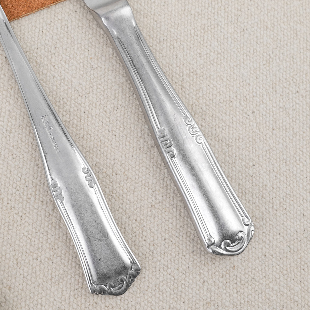 Ornate pewter 24-piece cutlery set