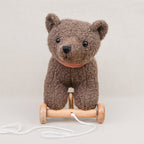 Pull-along bear cub on wheels