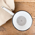 Black edged enamel colander