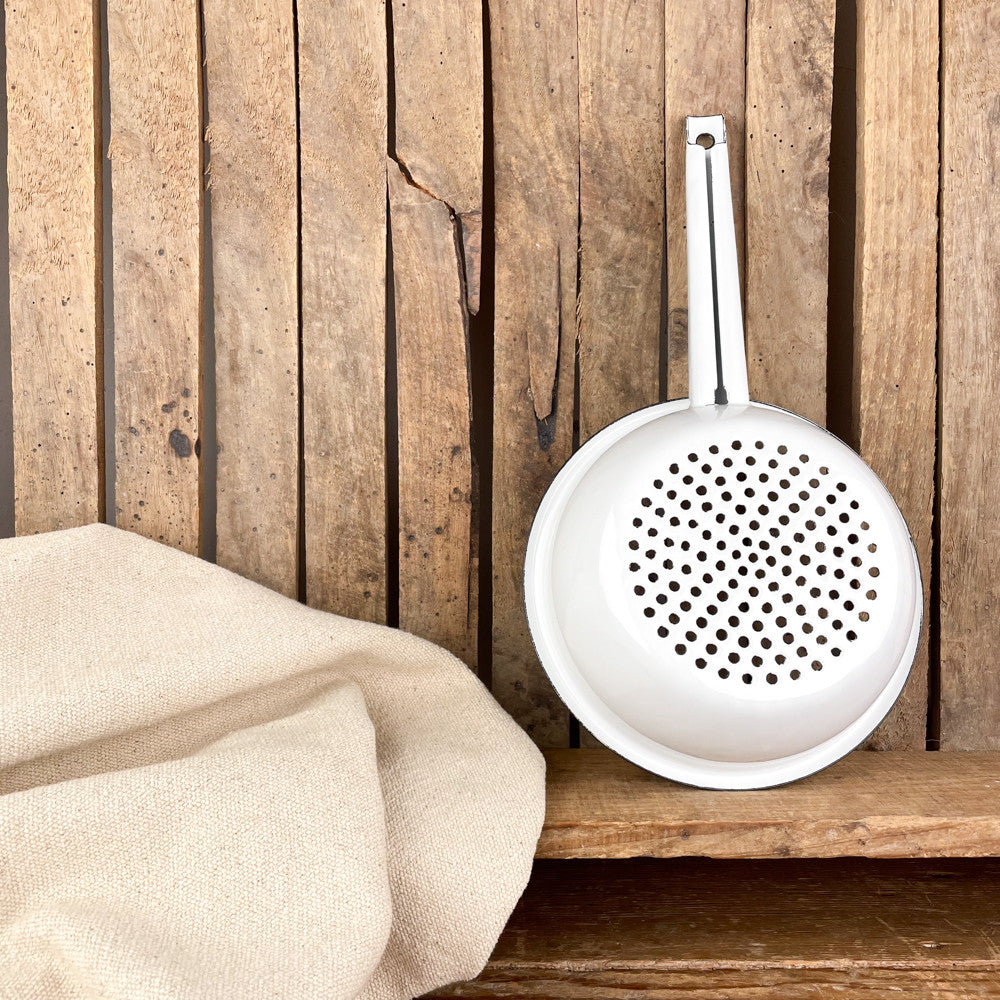 Black edged enamel colander