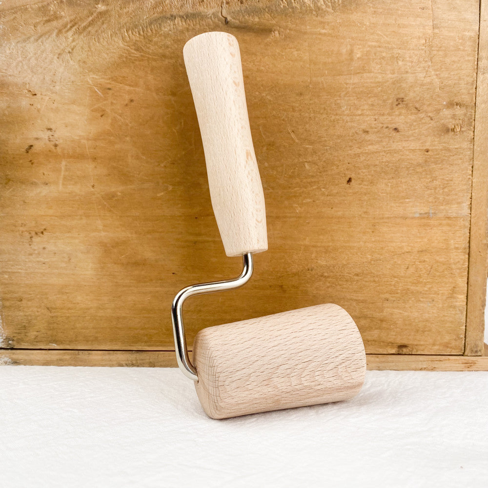 Rouleau conique à étaler la pâte